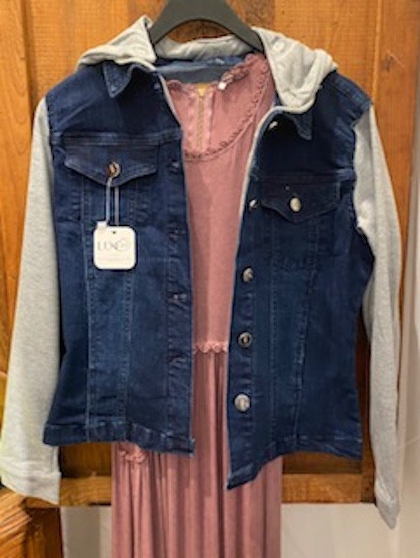 a pink dress and a blue jean jacket over it 
